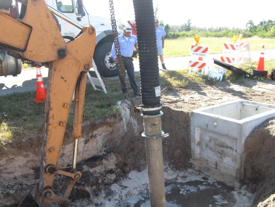 Workers using Vacuum Truck to Remove Sane and Debris from Drainage Network